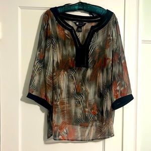 Sheer unique print top